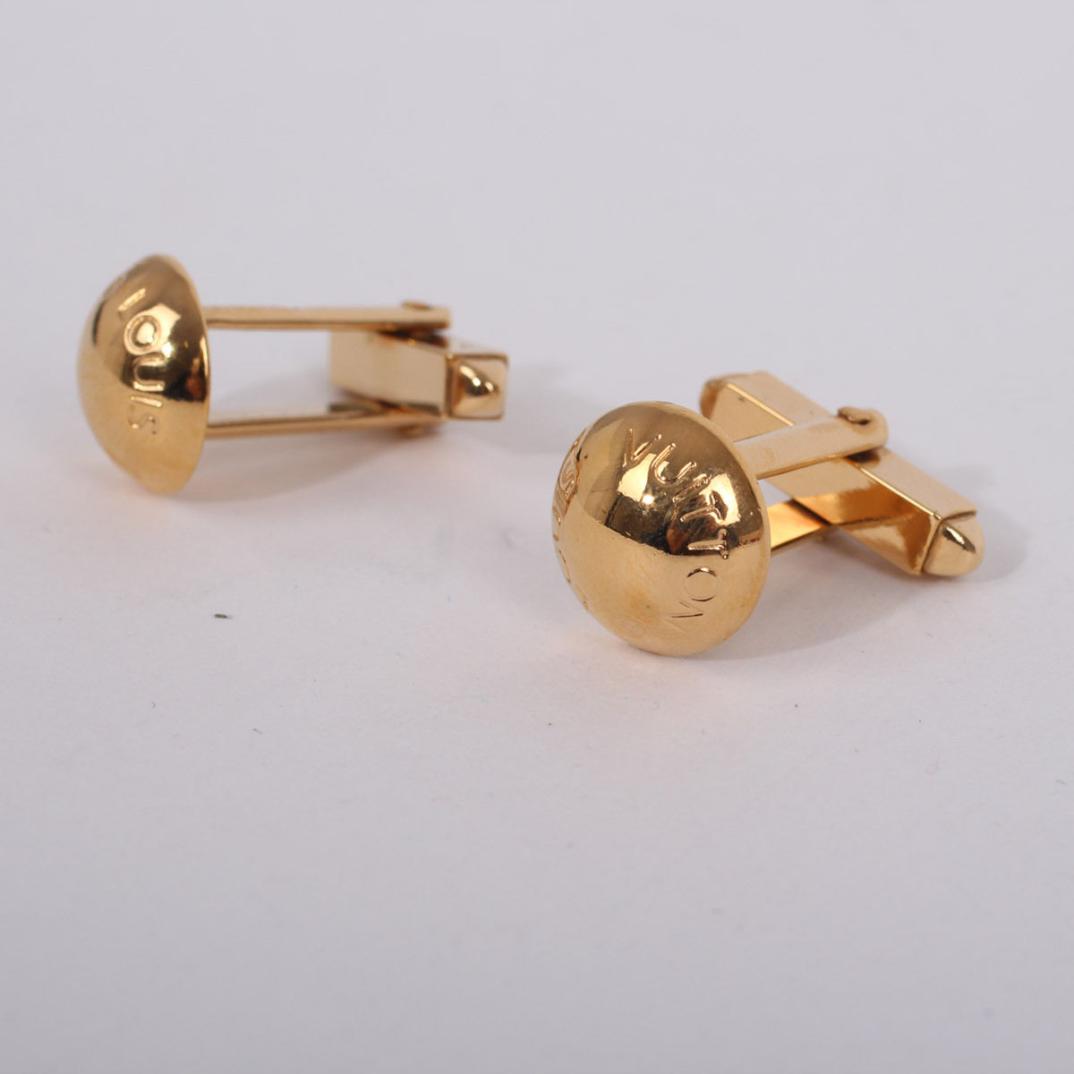 Louis VUITTON. Pair of gilded metal cufflinks with swive…